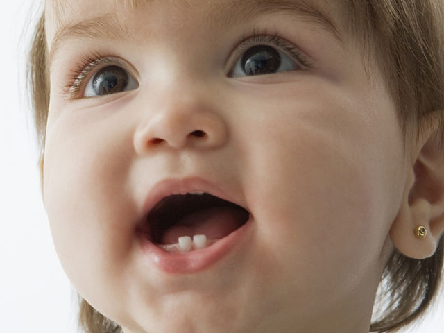 primary teeth eruption first tooth