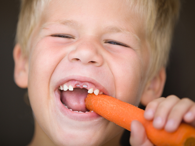 dennis dunne pediatric dentistry eugene oregon boy with carrot