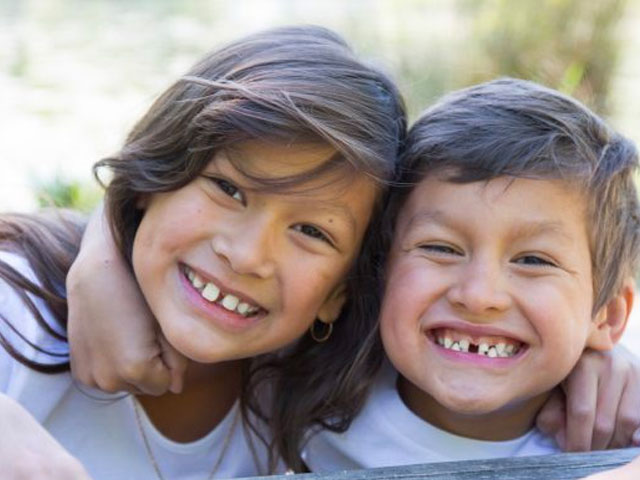 dr-dunne-dentist-eugene-oregon-native-american-kids-smiling